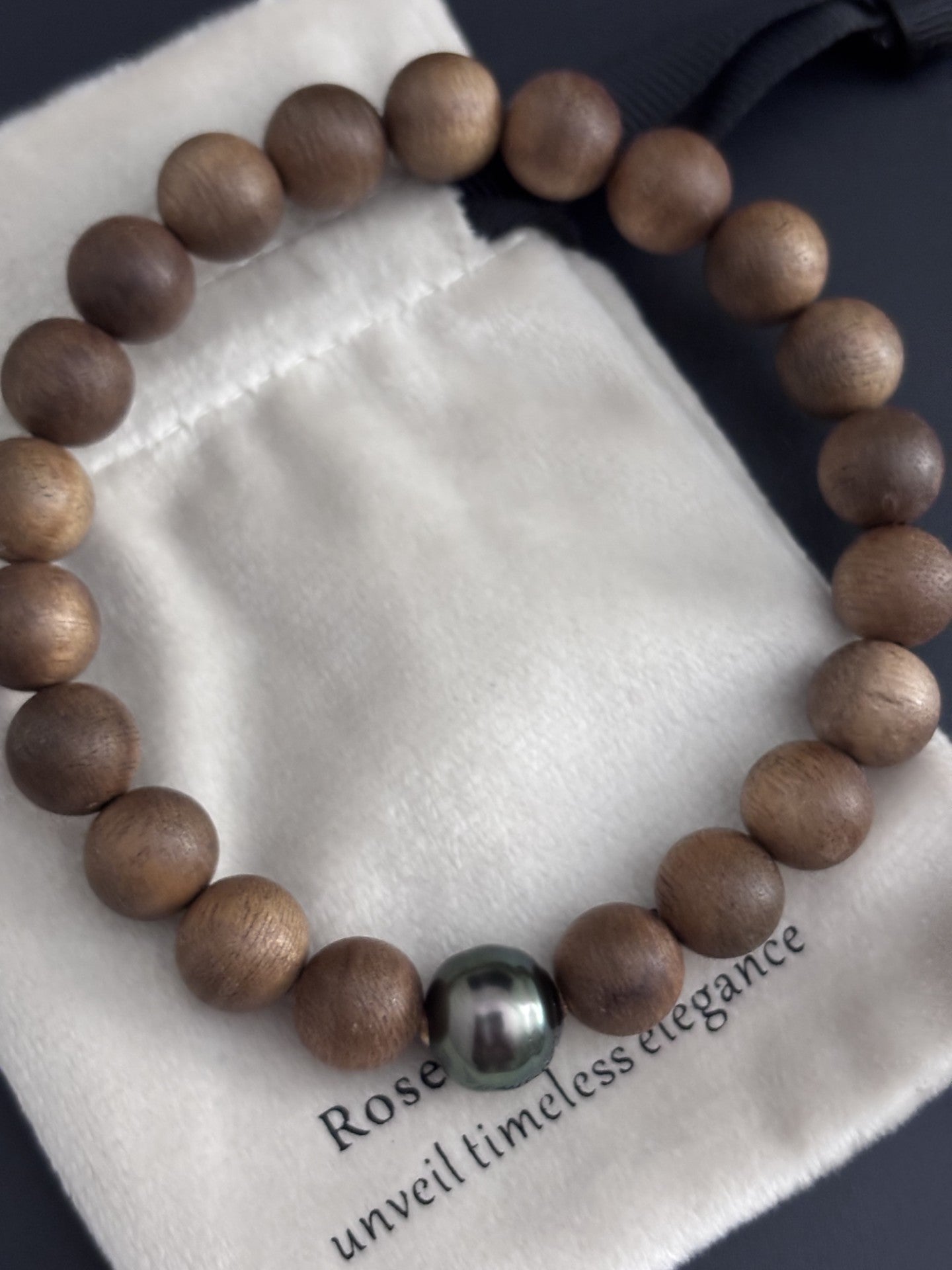 Sandalwood Bead Bracelet with a Tahitian Pearl Peacock Green Circle